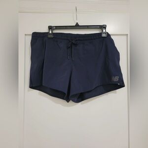 NWT New Balance navy blue Qspeed track shorts w/ side slits (good)
